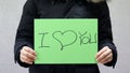 A woman holding a paper with the words. Royalty Free Stock Photo